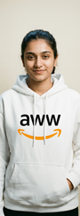 Person wearing a white hoodie with 'aww' logo on a plain background