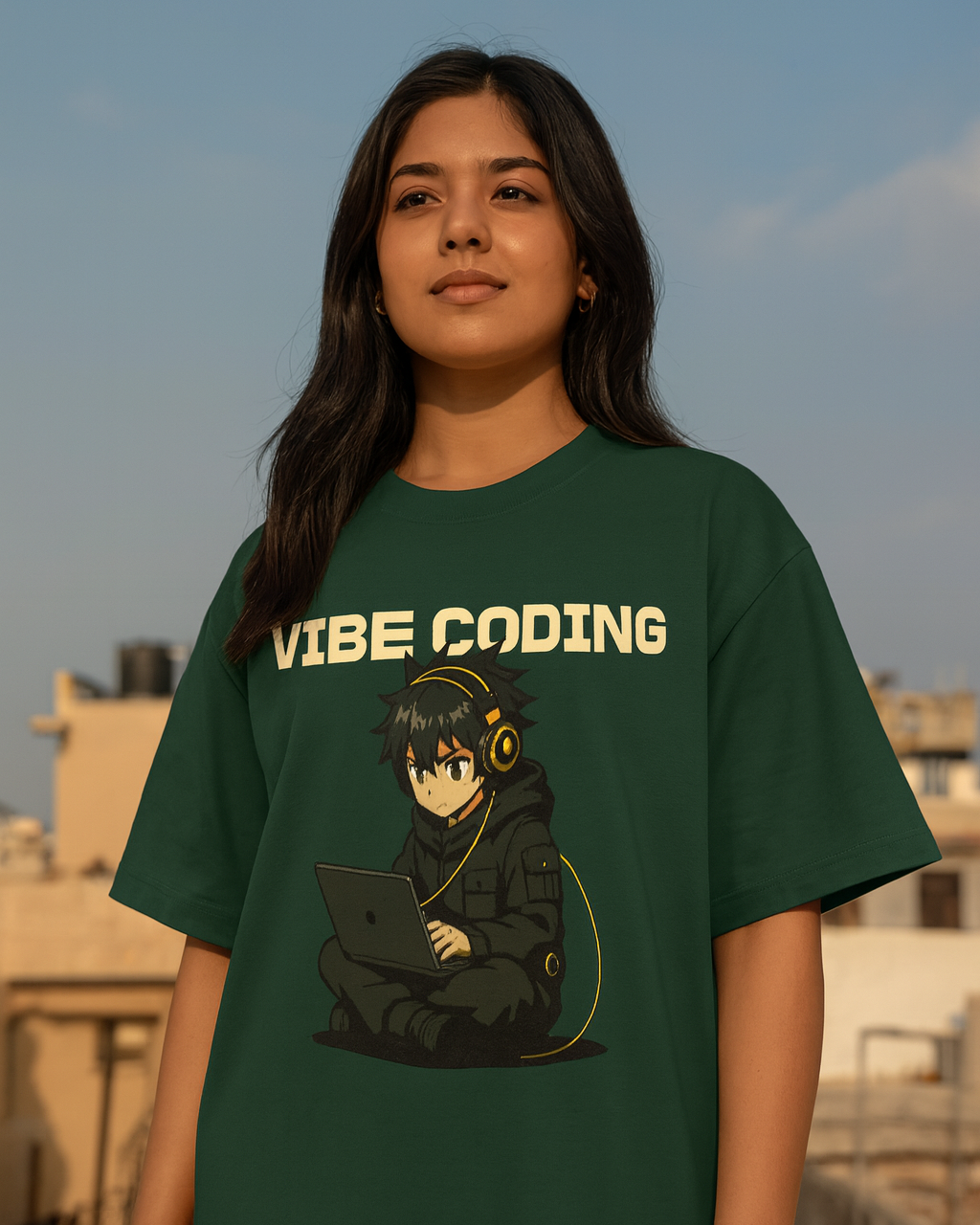 Person wearing a green t-shirt with 'Vibe Coding' design on a rooftop.